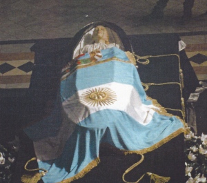 Evita's coffin with tassels  and silver voile ribbon - just visible on the right